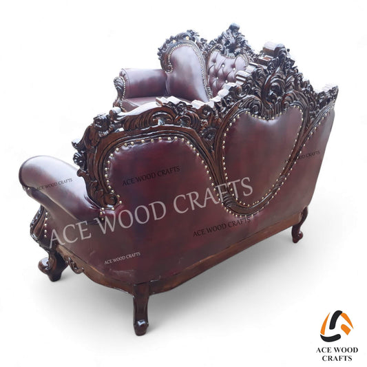 Front view of the 3-seater luxury teak wood sofa in antique gold finish and cream tufting.