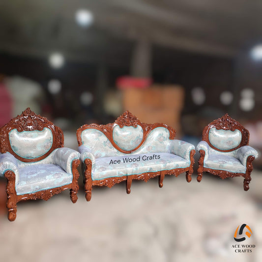 Angle view of the antique gold carved sofa set with teal blue velvet and center table.