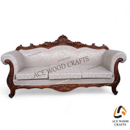 Front view of the 3-seater luxury teak wood sofa in antique silver finish and cream tufting.