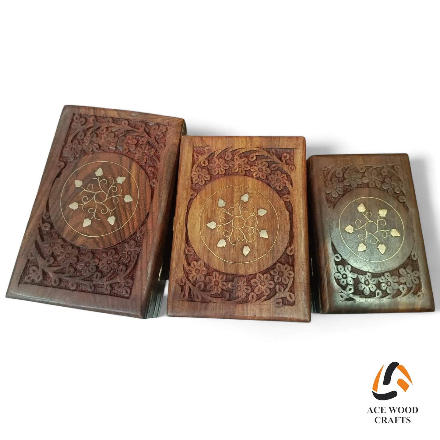 Top view of Sheesham wood jewellery boxes featuring a carved floral medallion with real brass leaf inlay.