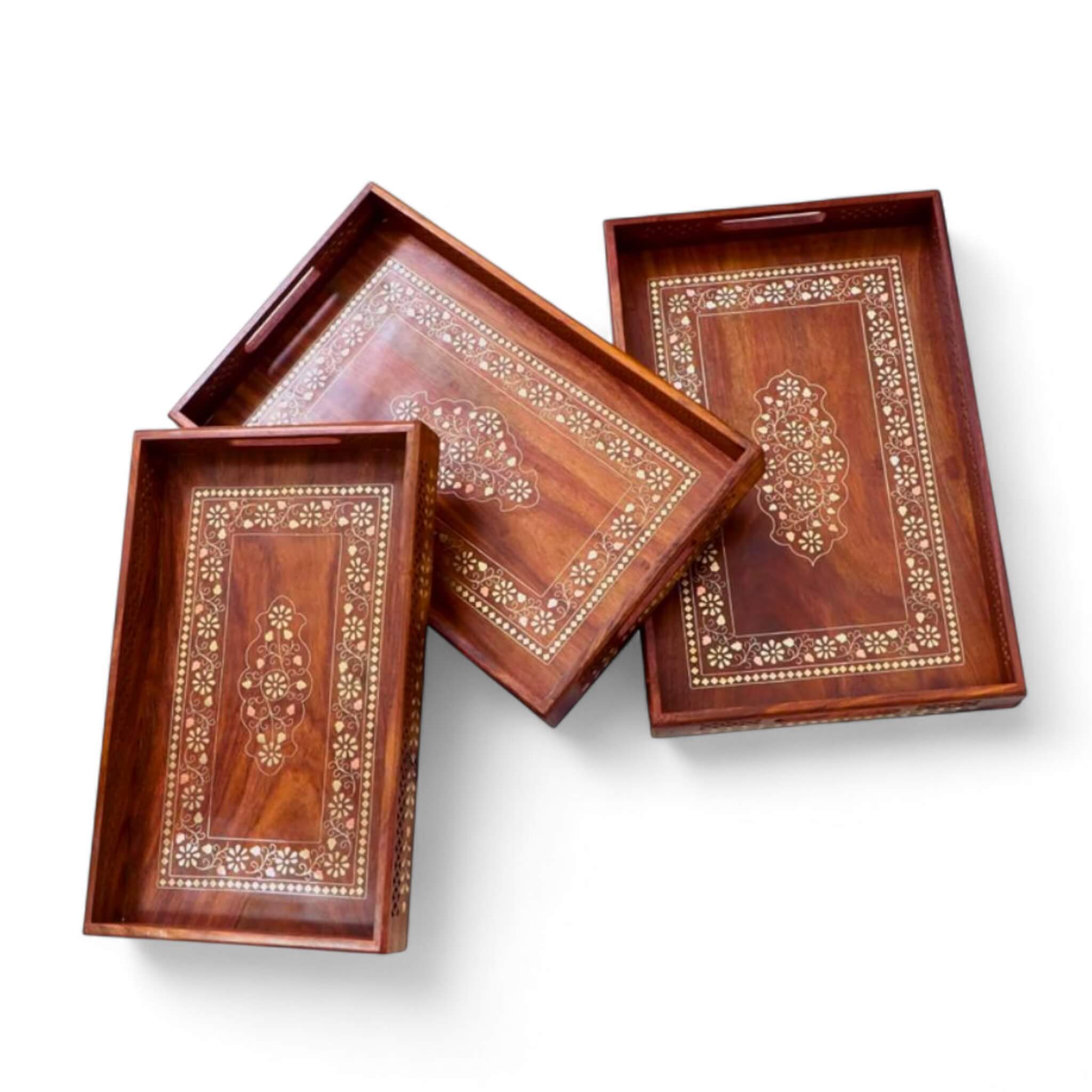 Top view of round wooden tray serving coffee mugs and planter.