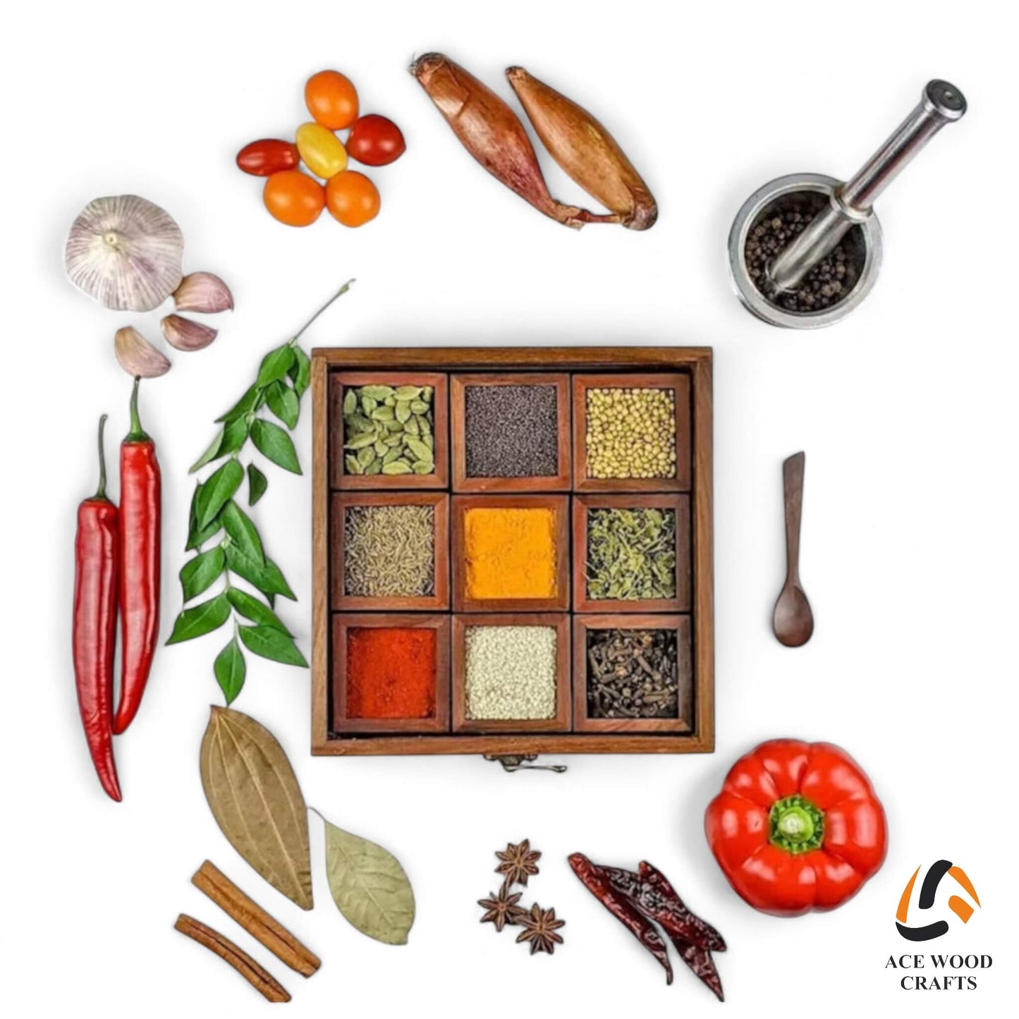 Creative flatlay of wooden spice box surrounded by fresh indian spices and ingredients.