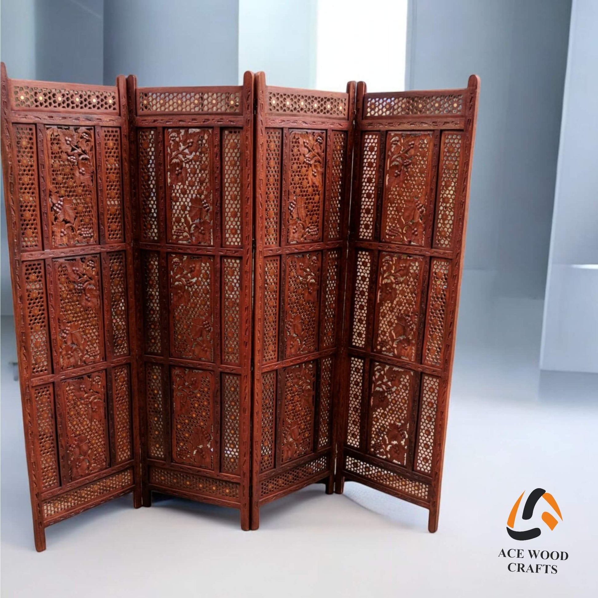Front-facing view of the complete 4-panel partition showing consistent floral carving across all panels