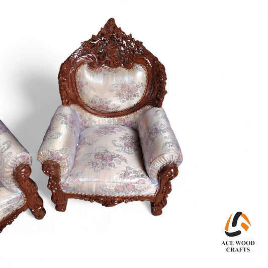 Side angle view of the single seater teak wood sofa chair with grey tufted velvet.