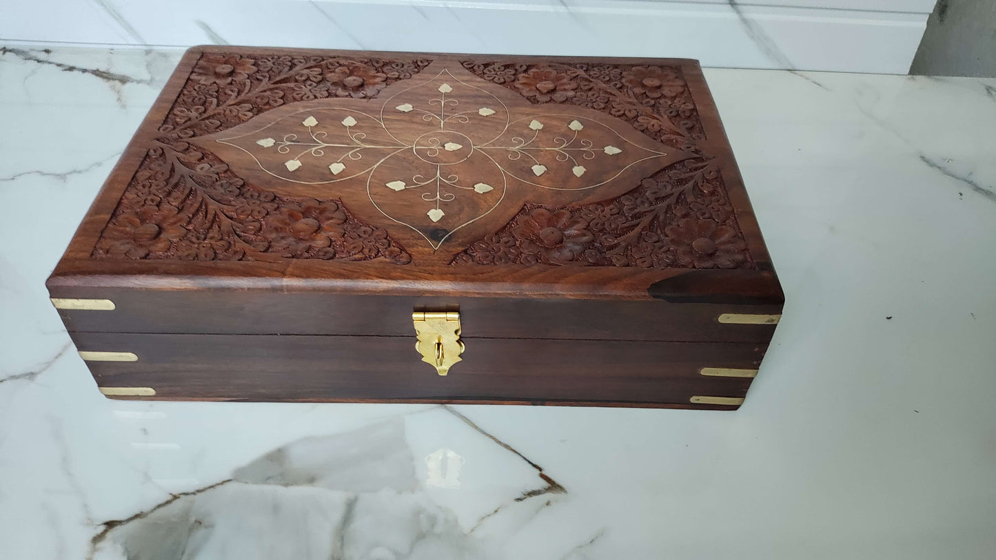Top view of rectangular wooden tray with deep grooved texture and brass leaf inlay.