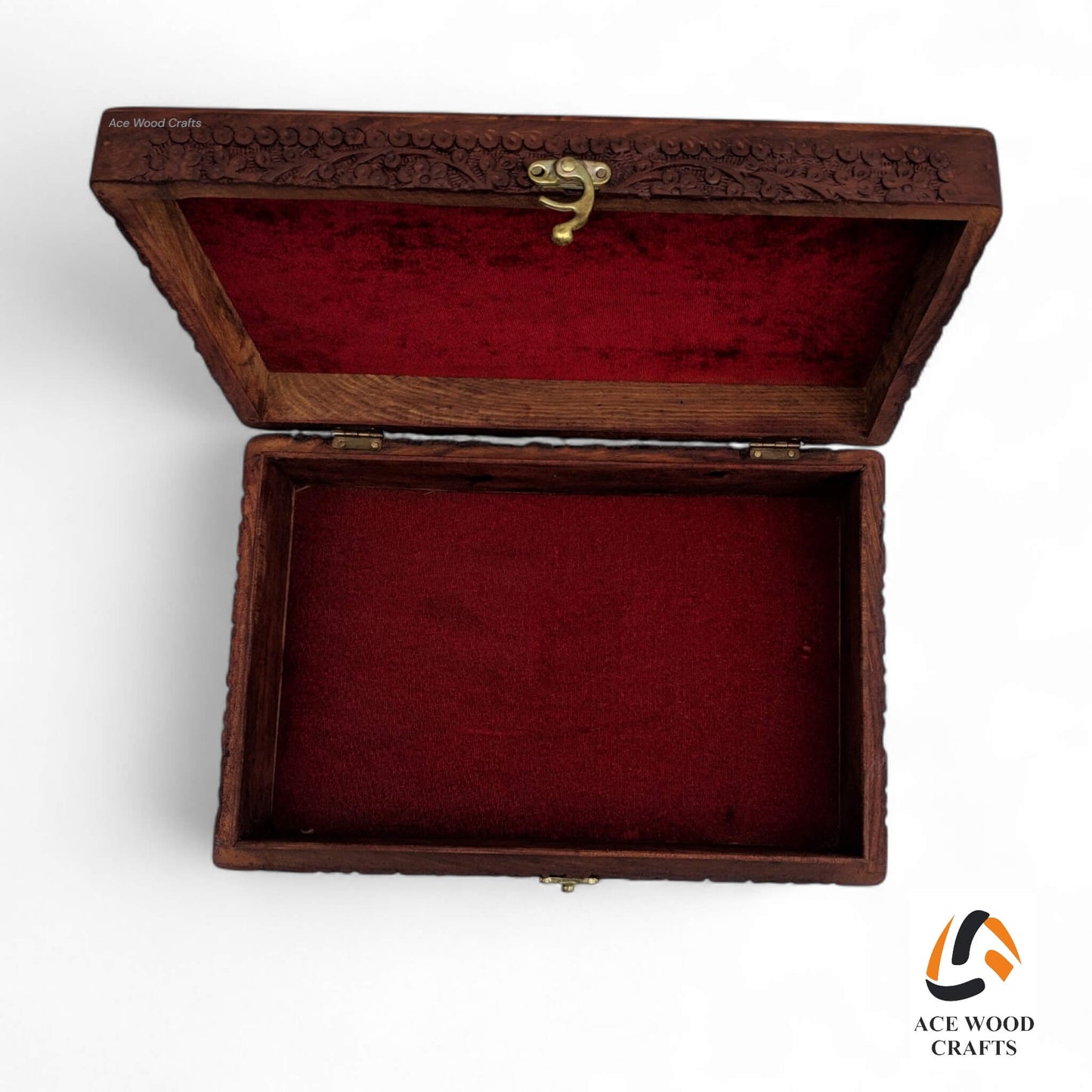 Front view showing the antique brass latch and reinforced corner brackets on the lid.