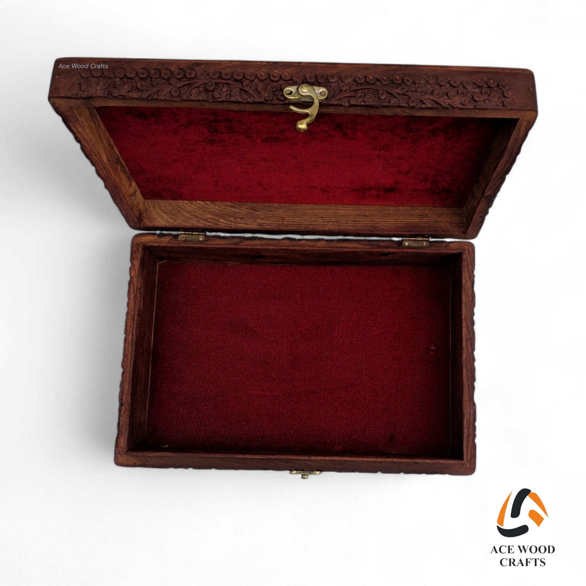 Front view showing the antique brass latch and reinforced corner brackets on the lid.