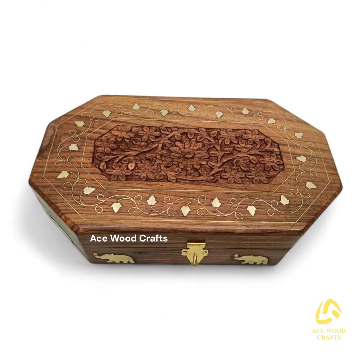 Top-down view of the floral brass inlay pattern on the wooden lid.