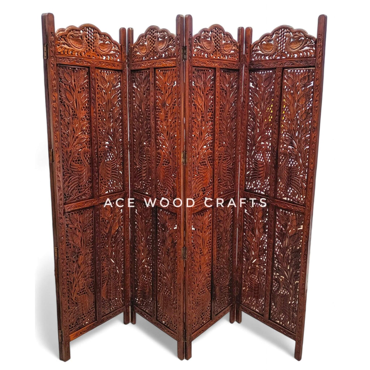 Close up detail of traditional peacock bird carving on solid sheesham wood partition