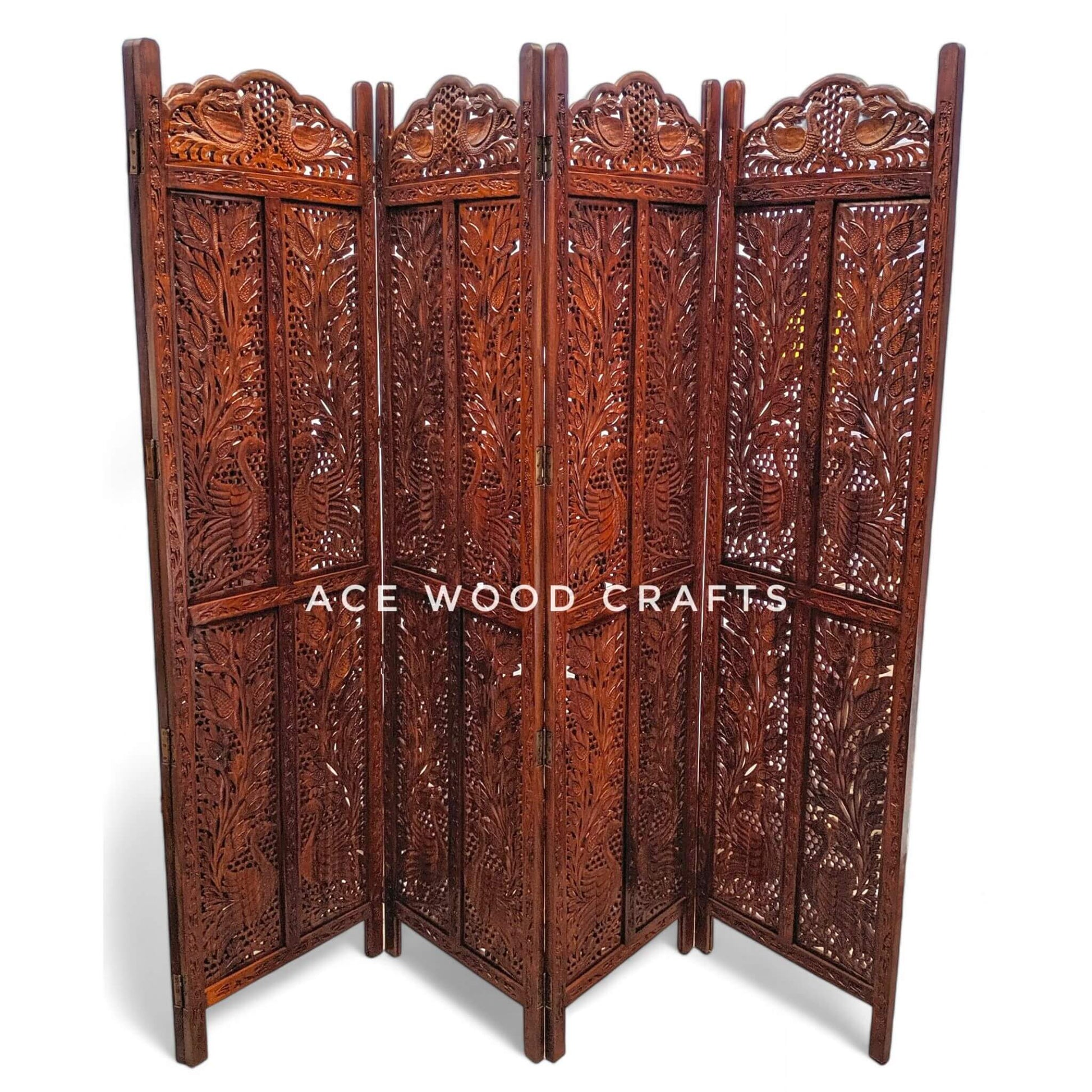 Close up detail of traditional peacock bird carving on solid sheesham wood partition