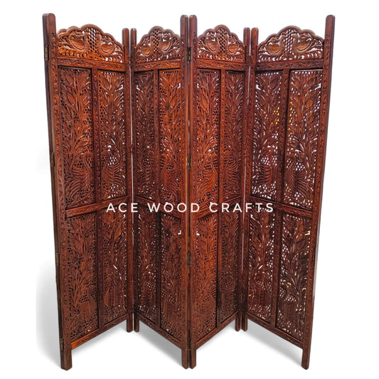 Close up detail of traditional peacock bird carving on solid sheesham wood partition