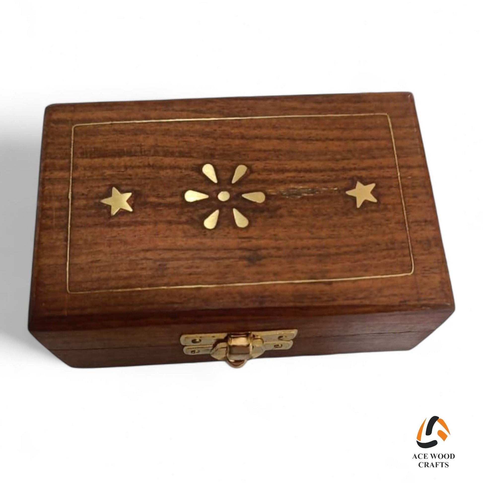 Top view of small wooden jewellery box featuring brass star inlay work.