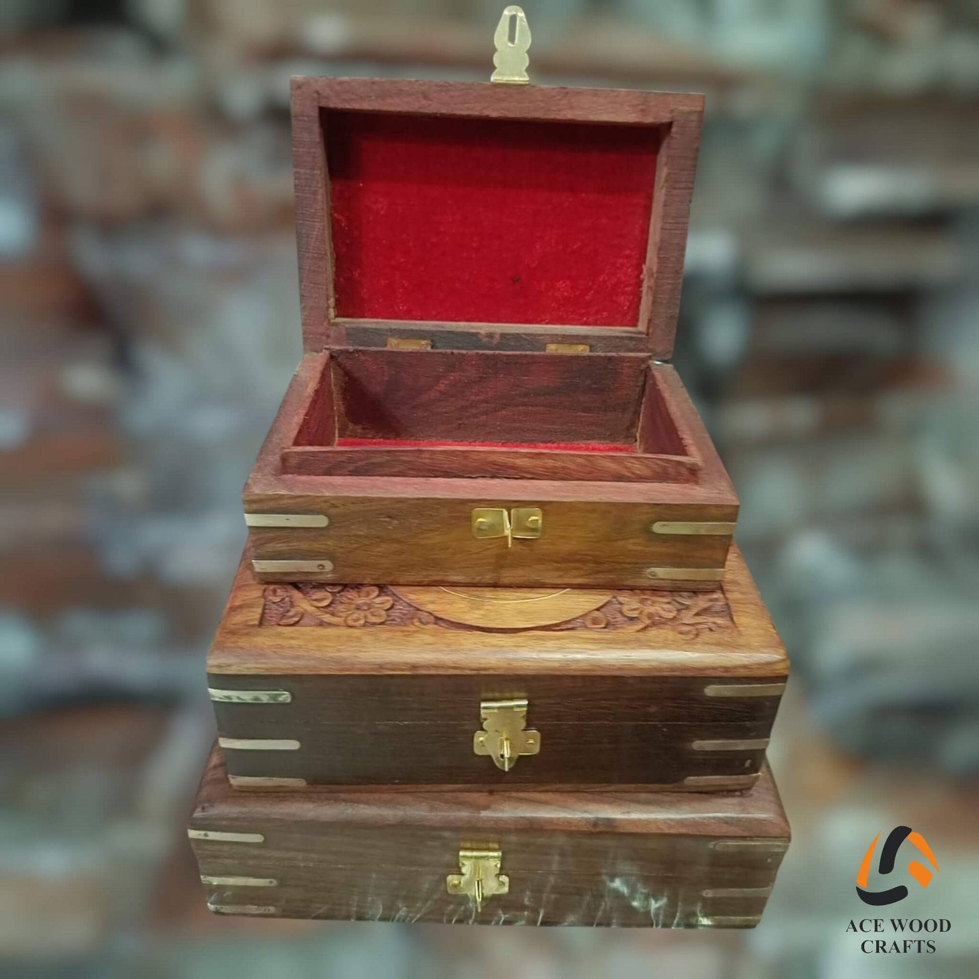 Open wooden keepsake box showing vibrant red velvet lining and a secure brass latch mechanism.