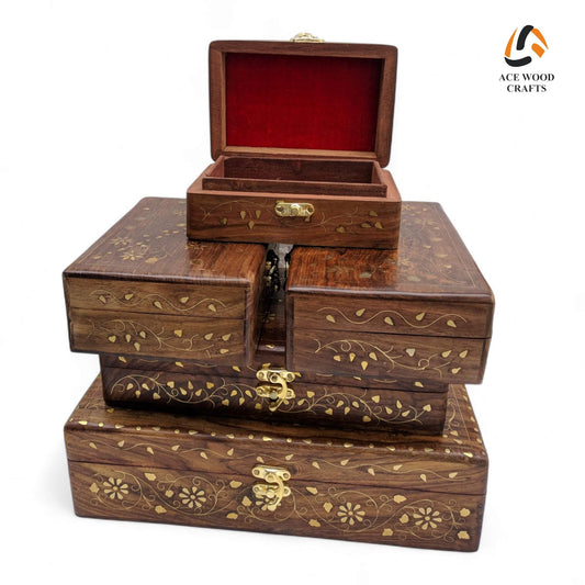 Open view of multiple wooden boxes showing plush red velvet interior and nesting capability.