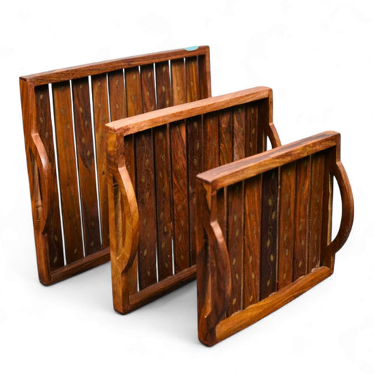 Angled front view of rustic Sheesham wood serving tray with natural bark edge and iron handles.