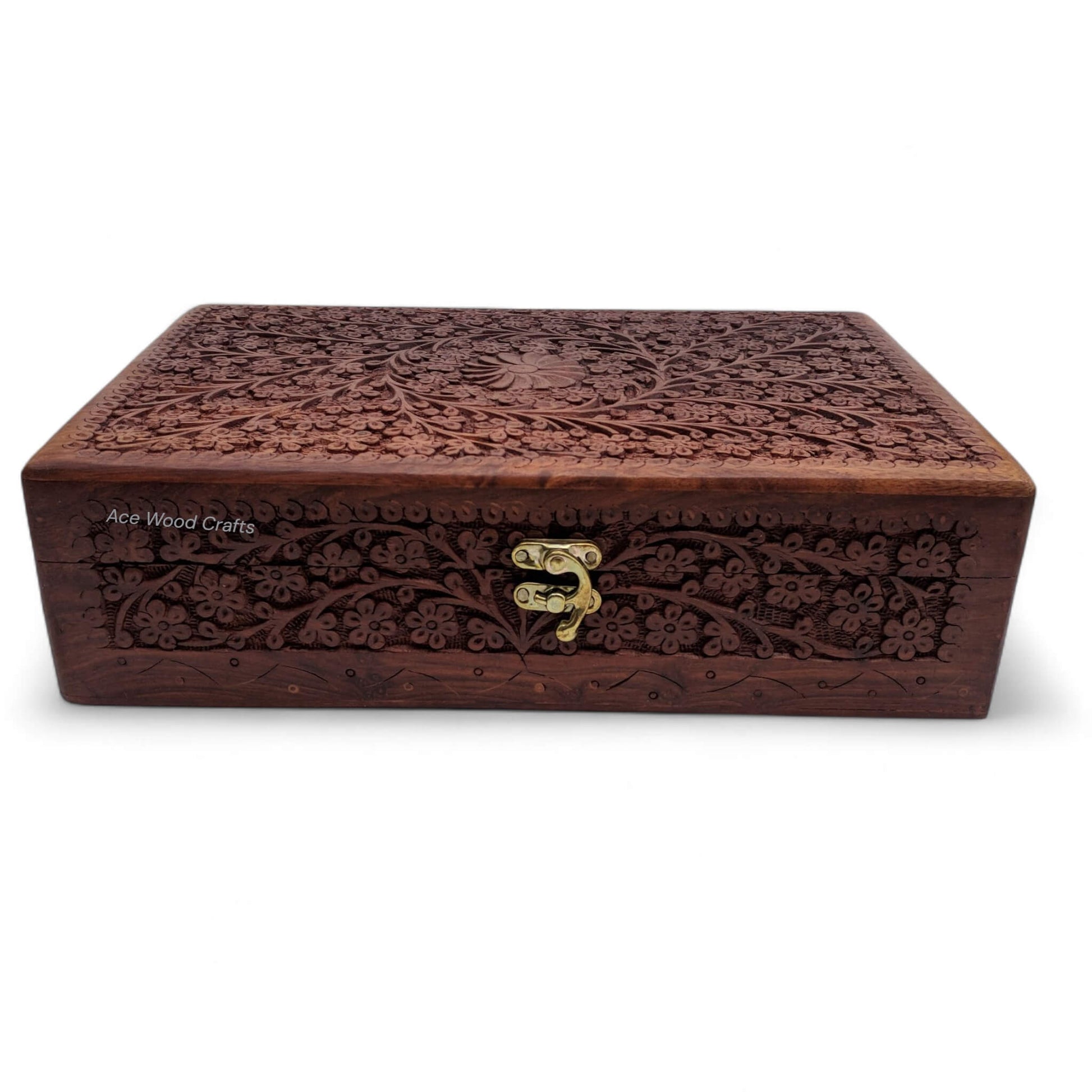 Top view of wooden jewellery box featuring a twin crescent brass inlay and floral carving.