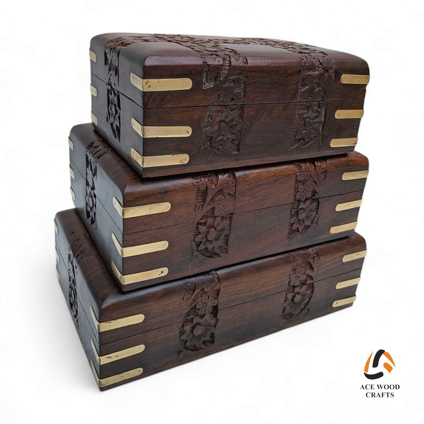 Side profile of stackable wooden keepsake boxes highlighting the depth of the hand-carved floral patterns.
