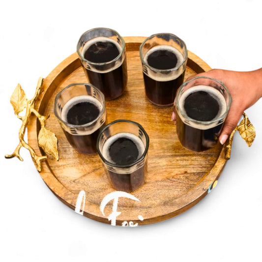 Top view of round rustic wooden serving platter with natural bark edge.