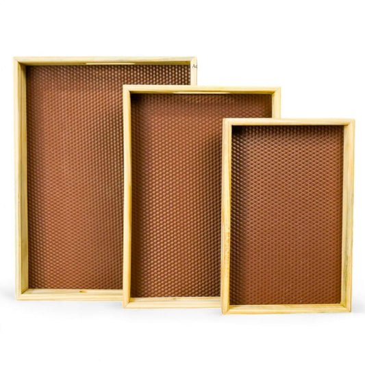 Front view of polished Sheesham wood rectangular serving tray with cutout handles.