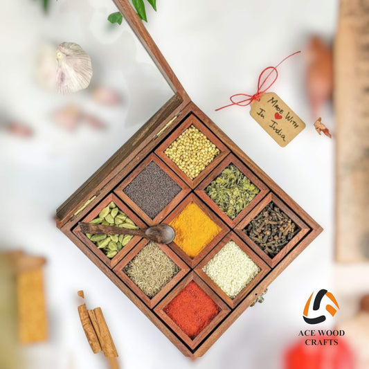 Top view of open wooden masala box filled with Indian spices and wooden spoon.