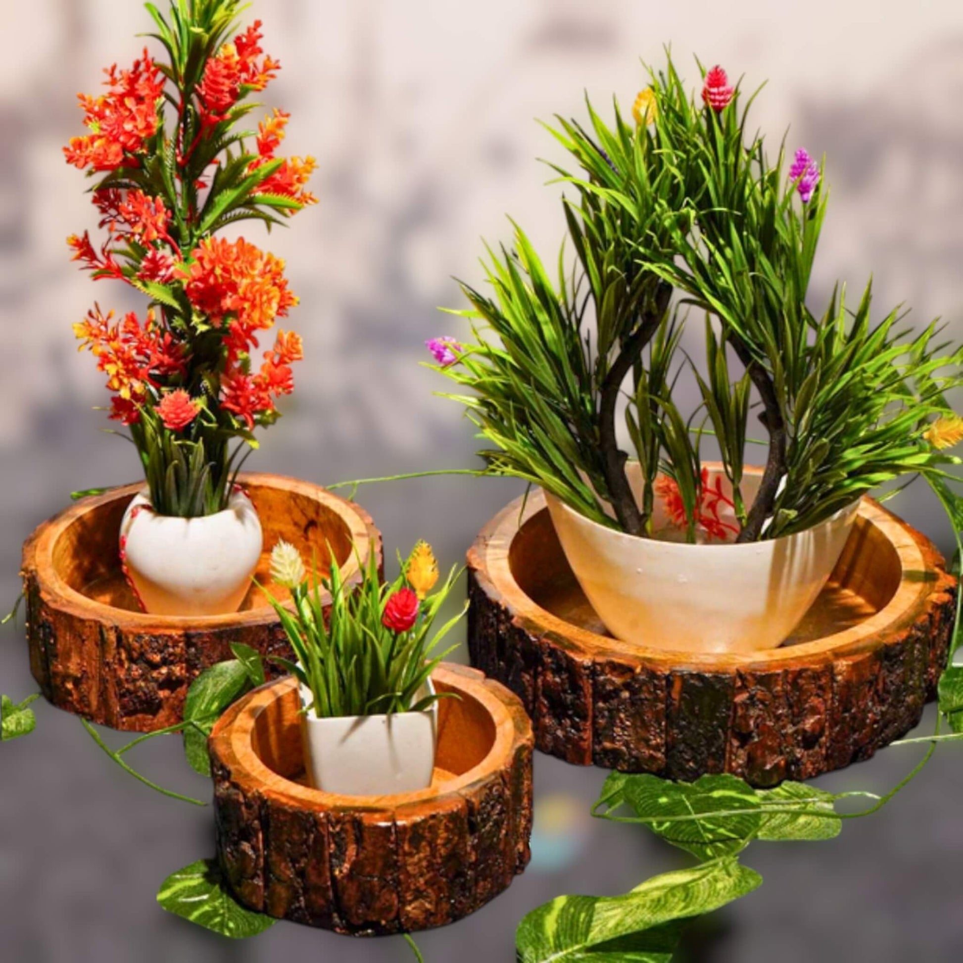 Natural wood bark bowls used as planters for artificial greenery.