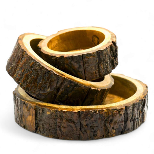 Stack of three rustic wooden round bowls with natural bark edges.
